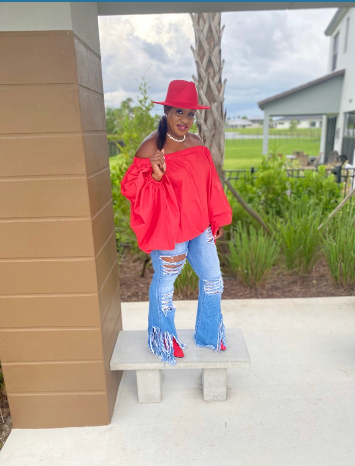 Red Balloon Dress worn as a top paired with our fray distressed jeans for a complete look.