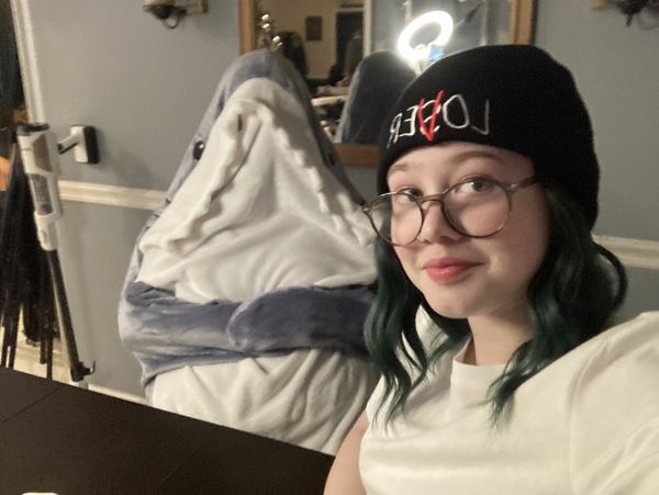 Shark onesie and teen in Loser's club beanie