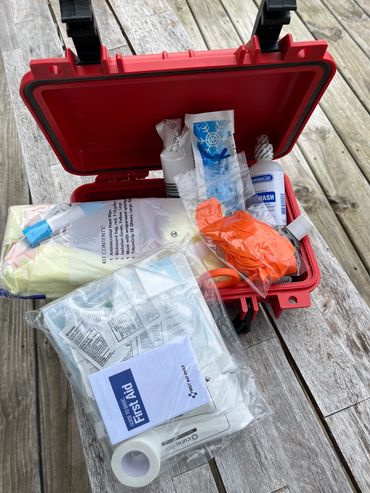 An Agency specific custom MiOSHA minimum compliant "A" First Aid and BBP PPE and clean up kit.