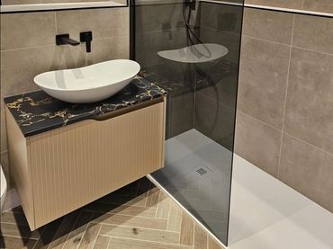 floor tile installation with precision edge cuts textured ceramic tiles on living room accent wall