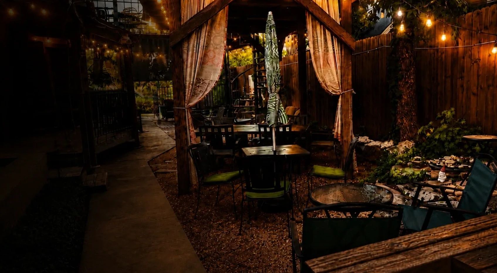 Cozy outdoor patio with string lights and seating.