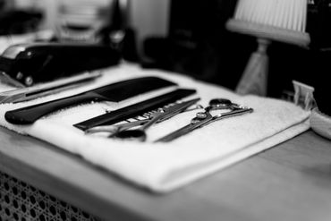 Barber Tools Placed on a White Napkin