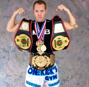World Champion Fighter Scotty Rae Leffler displays some of his Title Belts