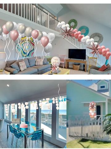 Elegant balloon decorations in a modern living and dining area, with outdoor accents.