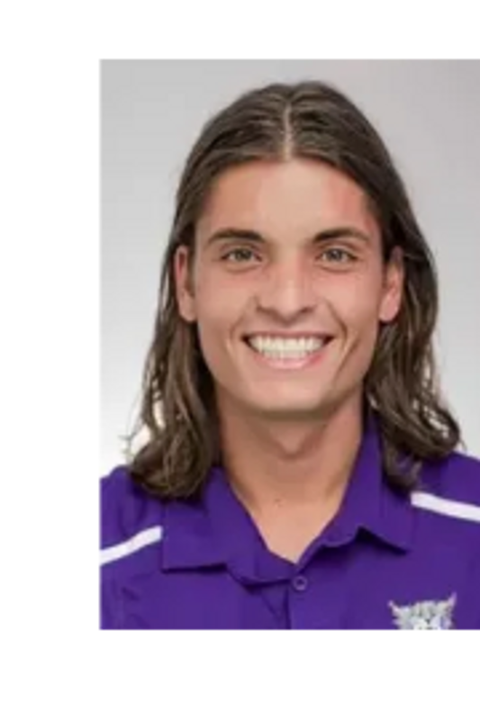headshot of a person in purple t shirt