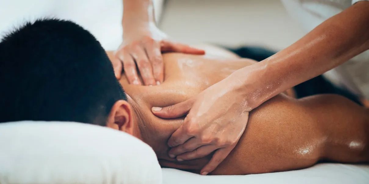 Client receiving neck massage