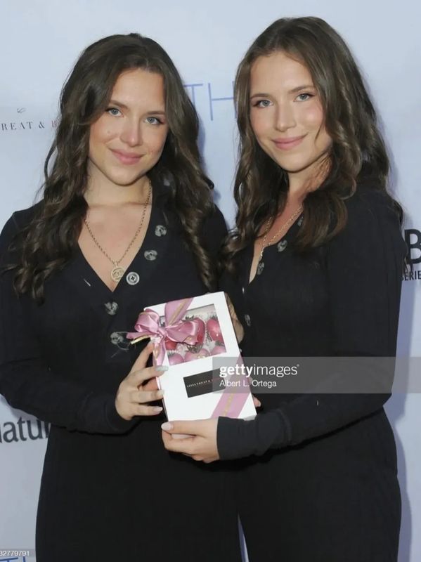 Getty images photo with D’Ambrosio twins holding LT&B box of chocolate covered strawberries 