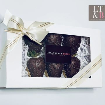 Dark chocolate covered strawberries with hand piped chocolate designs 