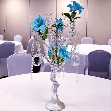 Blue flower centerpiece for event rental.