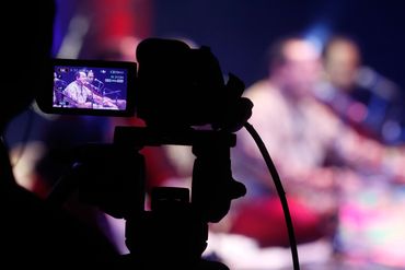 Video camera recording a live music performance