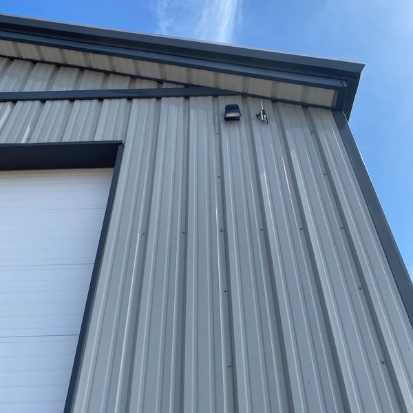 Cobwebs removed from light fixture