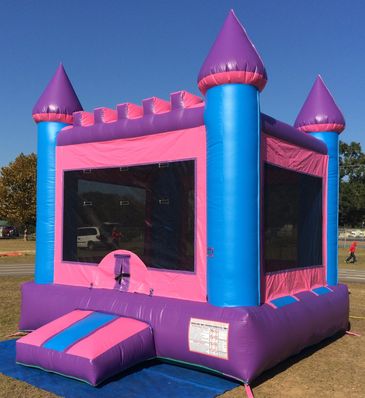 Pink, purple, and blue princess castle inflatable bounce house
