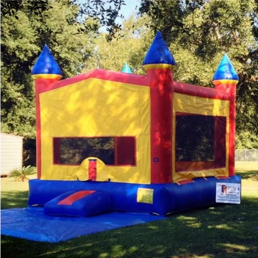 Large primary colored bounce house for boys and girls