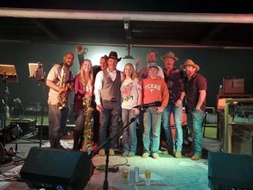 Guests and musicians together on the outdoor stage at the 2023 Doyle Boil.