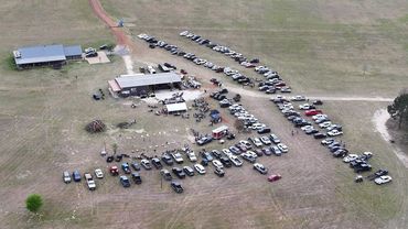 An aerial view shows the venue, gathering areas, and rows of parked vehicles at the 2026 Doyle Boil.