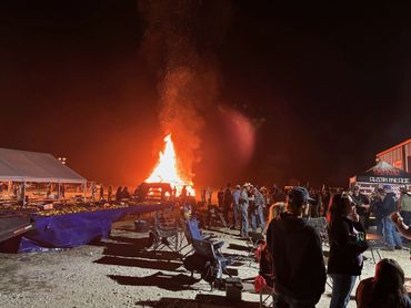 The bonfire lights the evening gathering at the 2026 Doyle Boil.