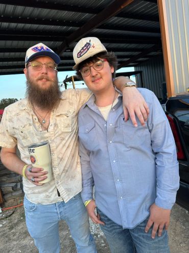 Two smiling guests pose together outdoors at the 2025 Doyle Boil.