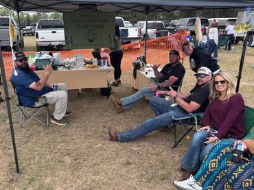 Guests relax under the Pineywoods Health and Wellness Clinic IV infusion tent at the 2026 Doyle Boil