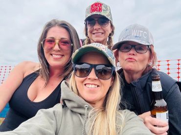 Four friends take a selfie together at the 2026 Doyle Boil.