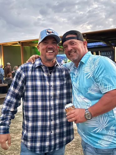 Two friends pose together near the stage at the 2026 Doyle Boil.