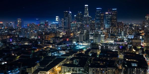 City skyline illuminated at night.