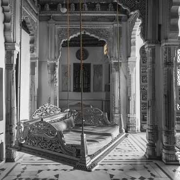 Intricately carved wooden swing in a traditional ornate room.