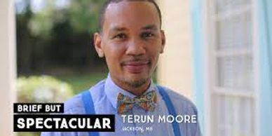 Portrait of Terun Moore smiling outdoors.