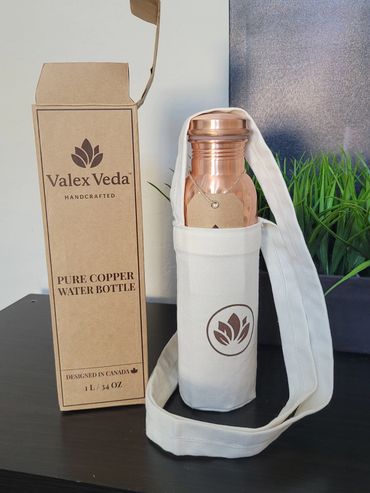 Valex Veda handcrafted pure copper water bottle with carrying pouch and packaging.