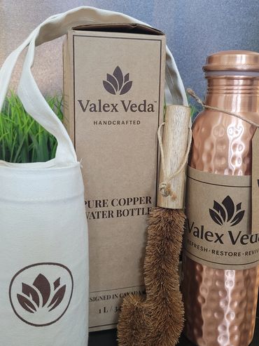 Valex Veda handcrafted pure copper water bottle set with cleaning brush and carrying pouch.