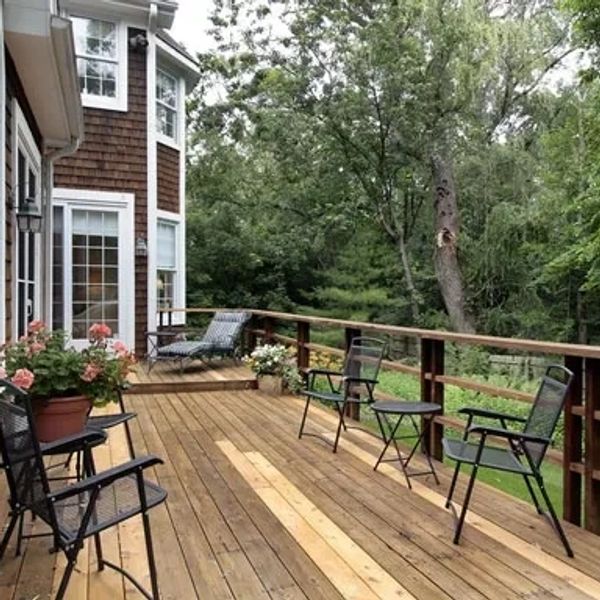 A lovely house deck of wood, freshly built