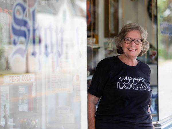 Ann Lawlor posing with a support local shirt on