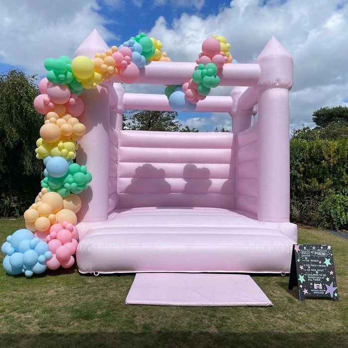 Pastel pink bouncy castle
