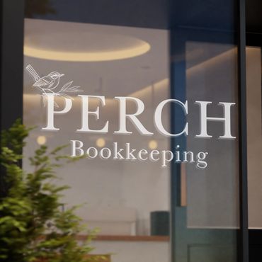 perch bookkeeping logo on glass door, white logo on transparent door, business signage