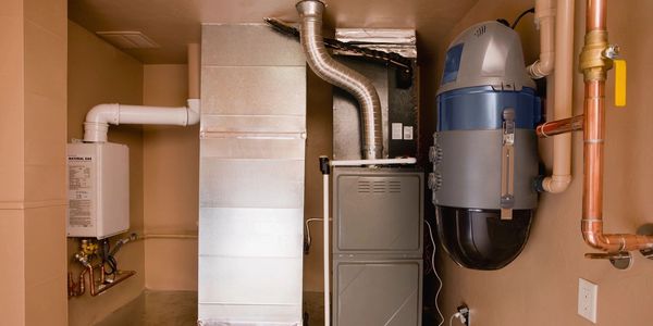 A domestic household boiler room with a new modern solid fuel boiler , heating electric warm water