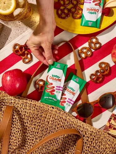 Chicago food photographer captures a bright summer picnic scene featuring Kindly Caramel squeeze pac
