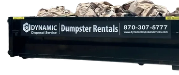 Dynamic Construction dumpster rental full of trash