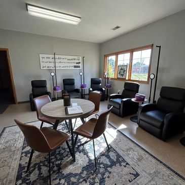 Recliners and a round table in the IV lounge at our Covington clinic