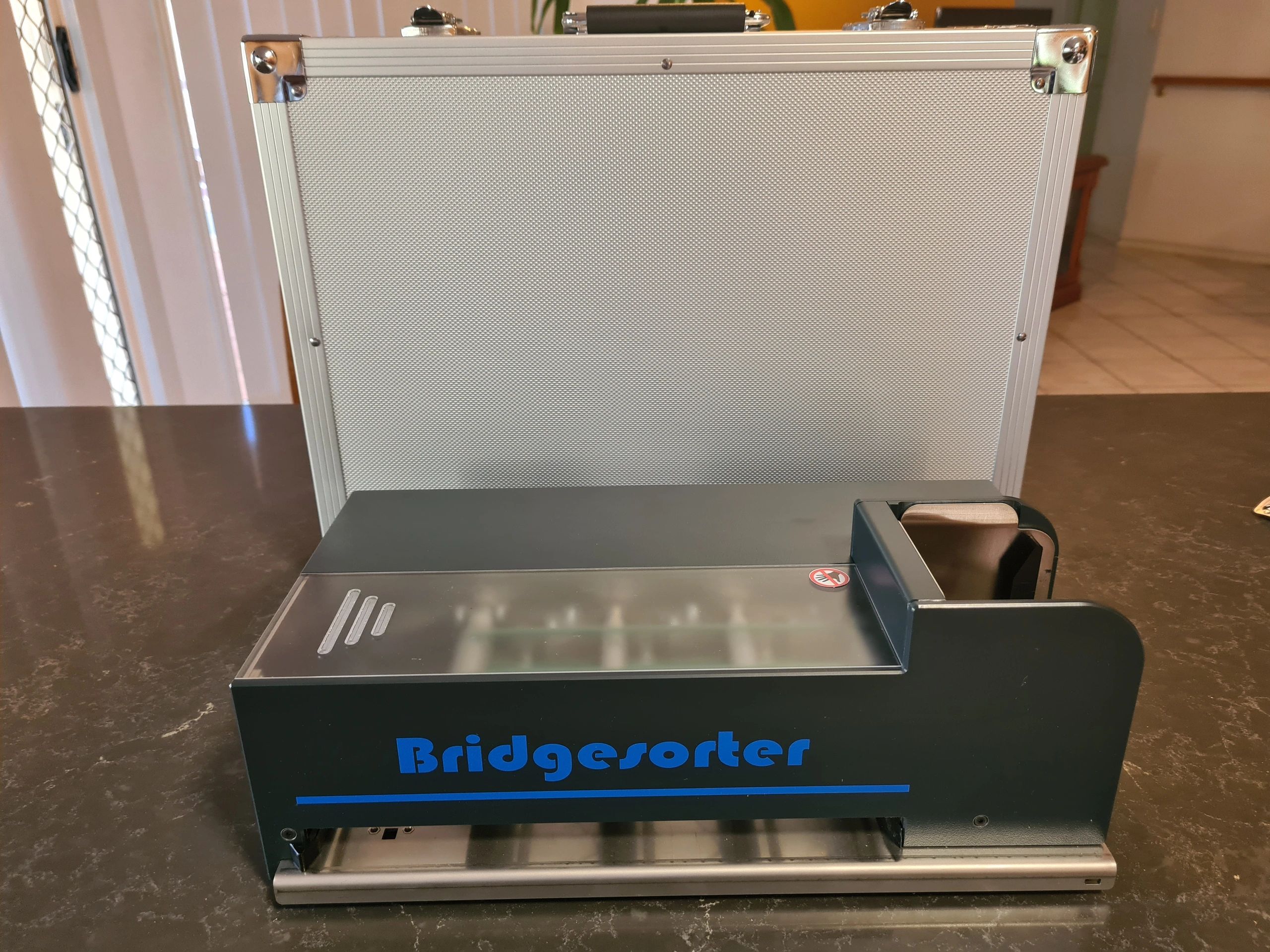 A Bridgesorter card sorting machine on a table.