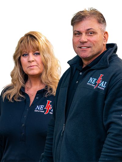 Two professionals wearing matching NEJAL Triple-Pane Windows uniforms.