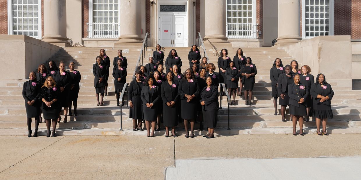 Members of the Omega Psi Omega wearing black