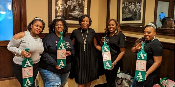 Silver Stars with the Omega Psi Omega president