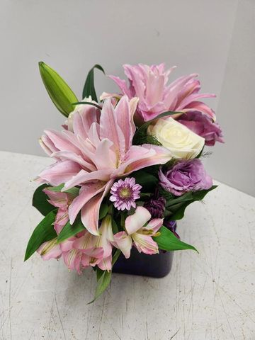 Tina Cube arrangement loaded with lilies, roses, carnations and more.  
CALL TO ORDER  602-246-1271