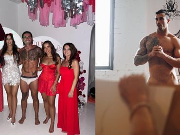 Male strippers posing with hens party guests during a Southern Highlands celebration.