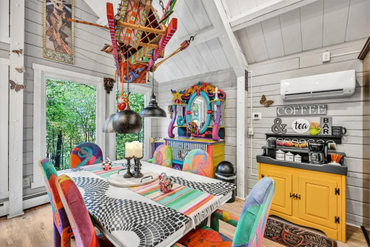 Colorful dining area with coffee bar in a charming artists cottage listed with airbnb & vrbo