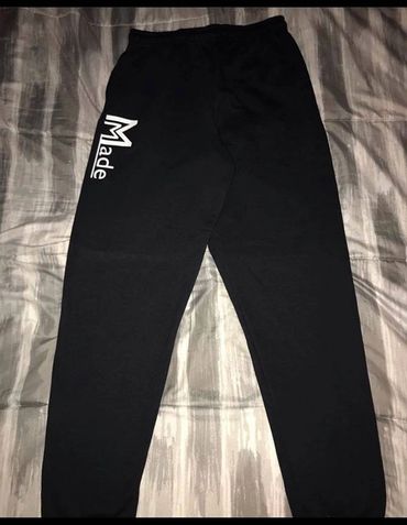 Black sweatpants with 'Made' logo on the left thigh.