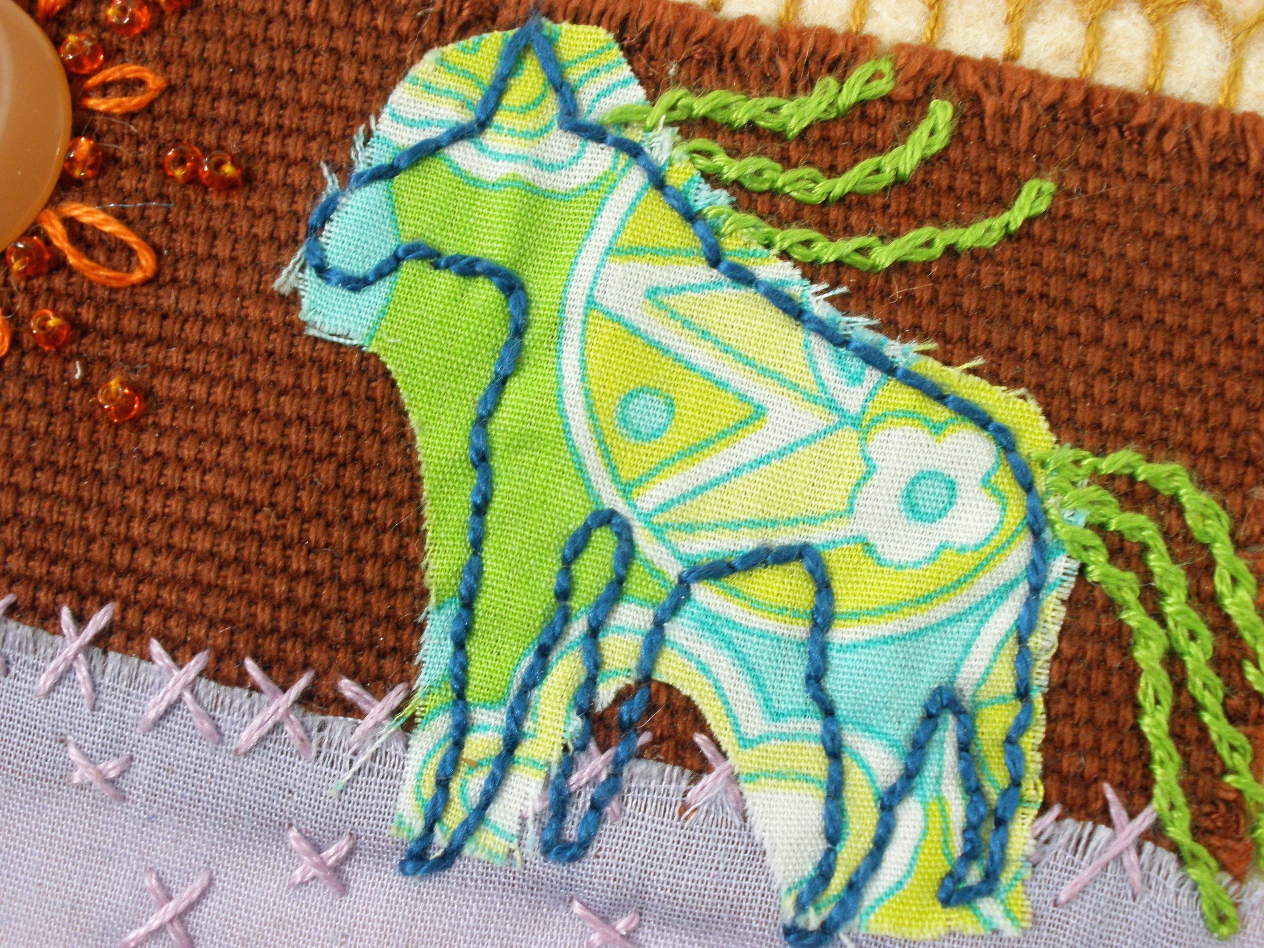 embroidered fabric collage of horse with beading