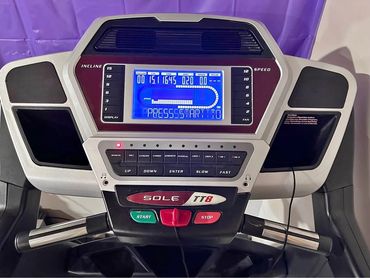 Close-up of a Sole TT8 treadmill control panel with digital display and buttons.
