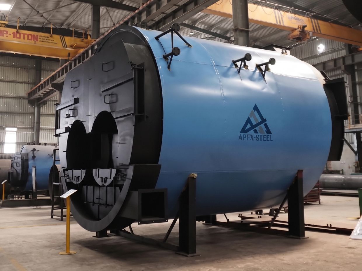 Large industrial boilers in a factory setting.