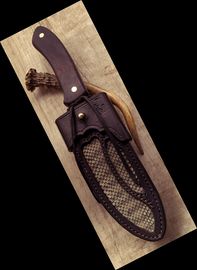 Custom leather sheath with rattlesnake inlay.