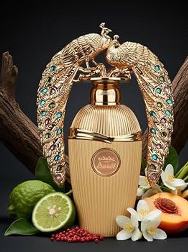 Elegant golden perfume bottle with peacock design, surrounded by fresh fruits and flowers.